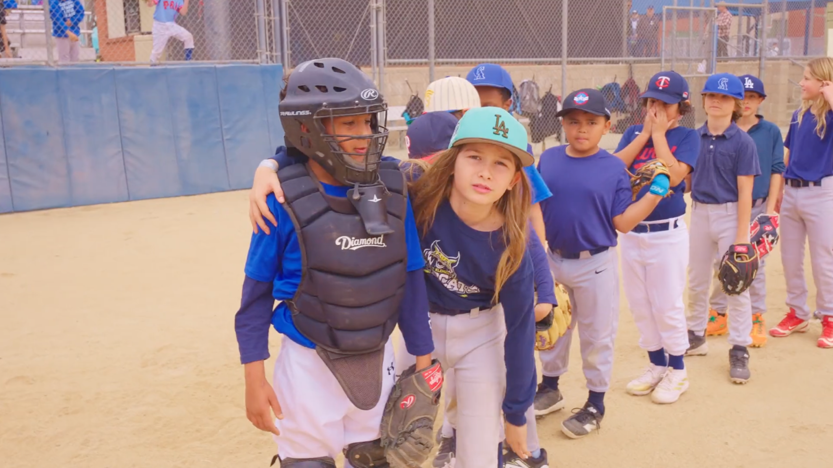 Going for Home documentary - Altadena Little League players and community members on the baseball field after the Eaton Canyon fire